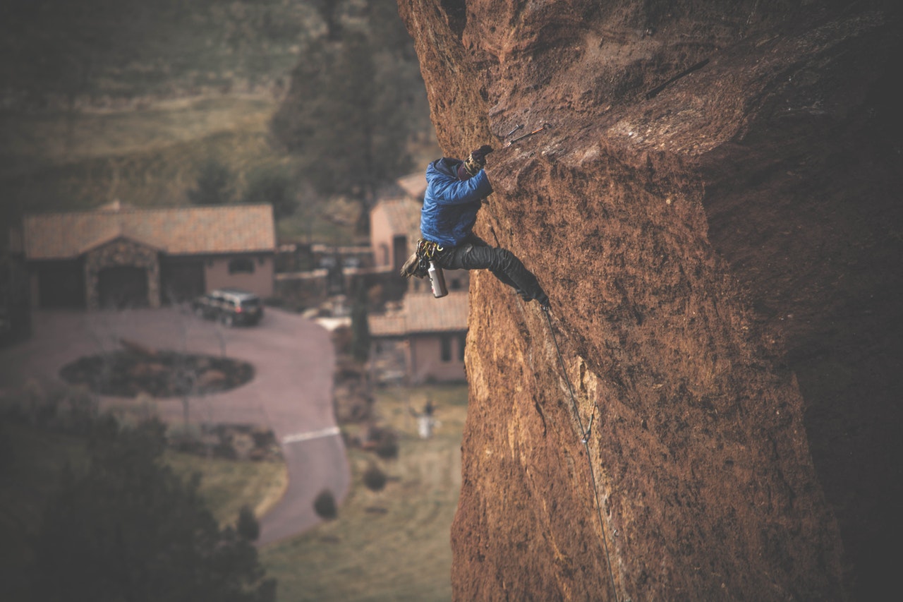 Man climbing cliff